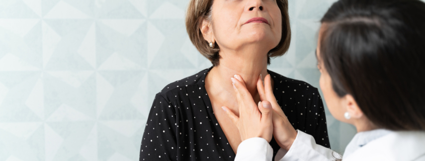 An image of a doctor feeling a patient's throat for dyphagia.